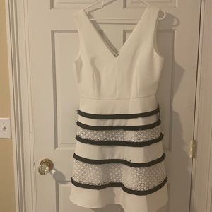 Adelyn Rae white dress with navy fringe and lace detail on the skirt